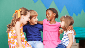 Kidswith arms around each other smiling