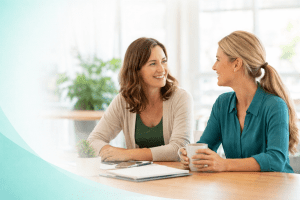 Two adults having a supportive conversation, representing foster care support and guidance
